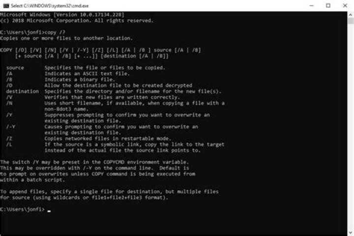 How do I copy a file in DOS?