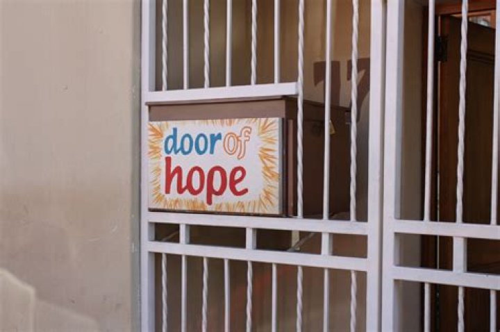 How do I volunteer for the Door of Hope?